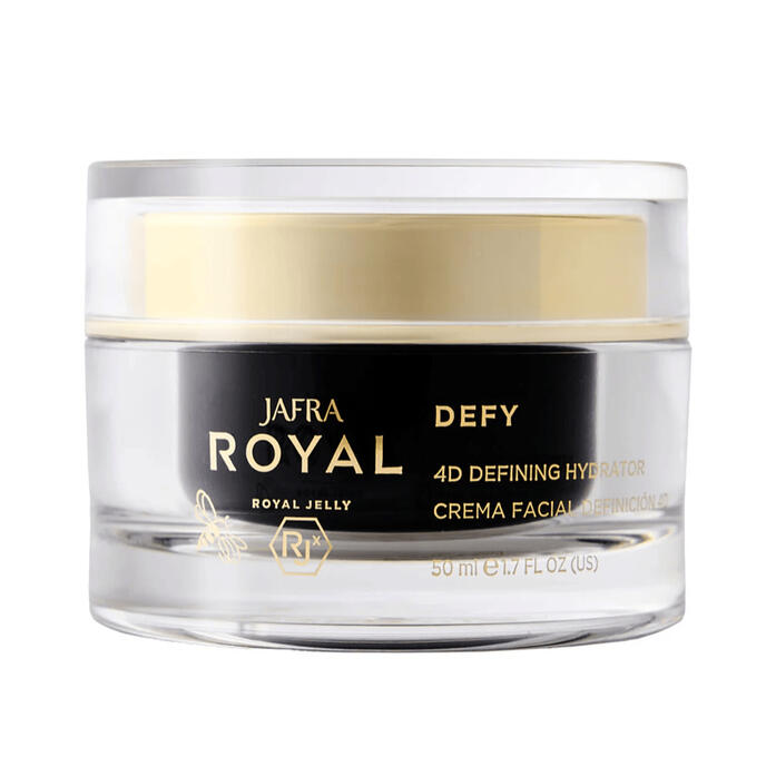 Jafra Royal Defy 4D A jar of JAFRA Royal Defy 4D, the jar is translucent giving the impression of clear glass, there is a honey gold colored cap submerged into the cap and a black vessel submerged into the jar that contains the cream. On the outside the main words printed in