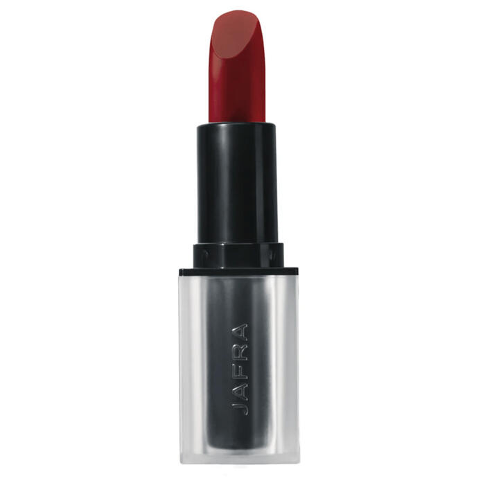 Jafra Lipstick An opened JAFRA lipstick standing upright, the color of the lipstick is reddish brown, the main body is black, and the base is chromed silver with the word JAFRA engraved into it.